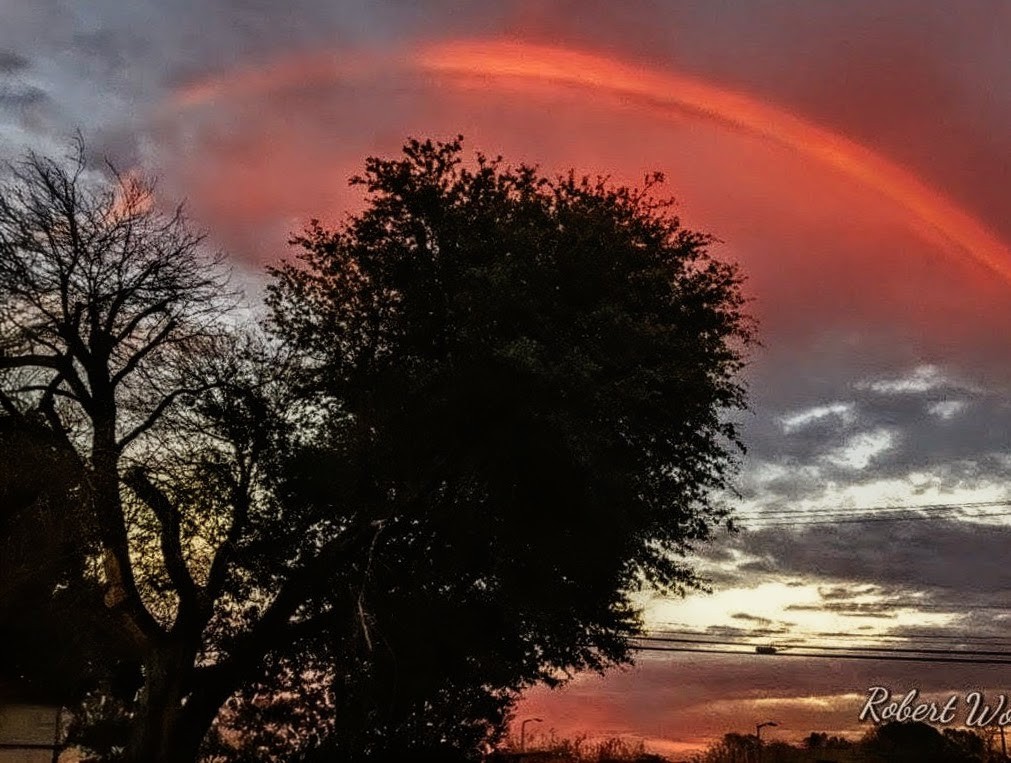 Rainbow Sunset — A breathtaking capture by Robert Wolfe